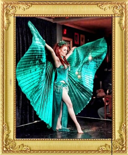 Cabaret dancers London Burlesque performers for hire. Burlesque dancer with giant green wings performing in London and Brighton
