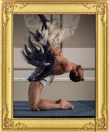 Boylesque male fan dancer reclines backwards performing with our dancing cabaret acts London and Brighton