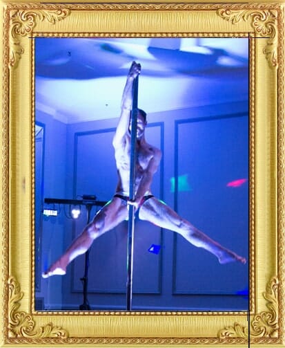 Male Burlesque dancer London male cabaret act holds pose on pole for our entertainment agency Brighton