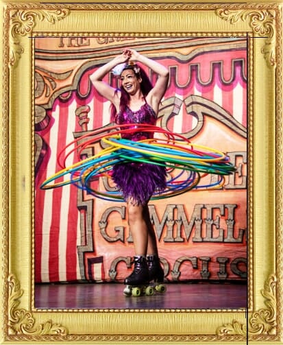 Vintage circus acts London and Brighton, roller skater with hula hoops in sequin, tutu costume.