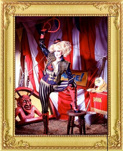 One of our circus acts in London and Brighton, cracks whip in crazy costume and giant wig