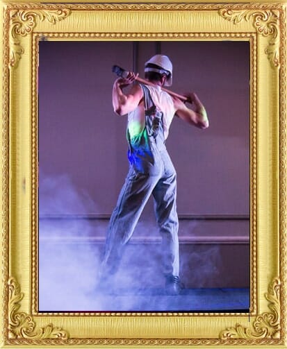 Construction worker cabaret dancer with sledge hammer bespoke entertainment in London and Brighton.