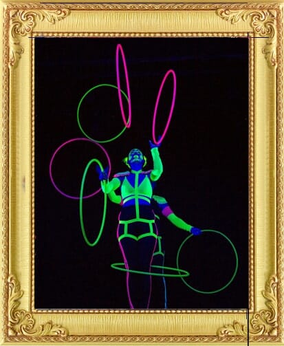 Unusual corporate party entertainment in London and Brighton, circus juggler in UV glowing costume