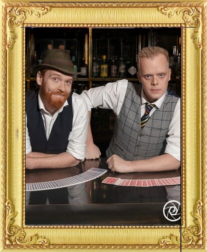 vintage 40's style magicians for hire with cards spread out for our entertainment agency Brighton
