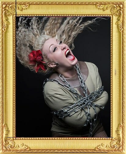 Female escapologist magician for hire in London and Brighton battles chains at London corporate event