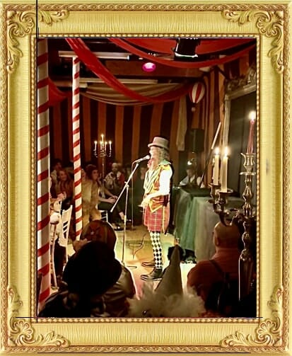 Magician for hire in London and Brighton performs on stage in vintage cabaret costume