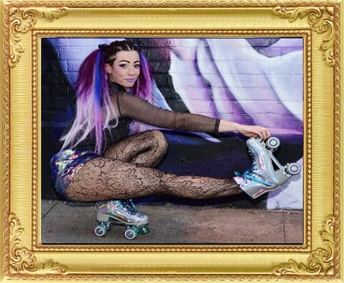 Roller skater in silver costume at theme event from our entertainment agency Brighton and London.