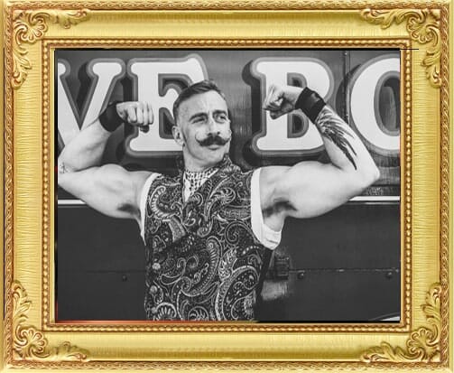Performers for Hire Brighton & London, vintage strongman performer London flexes muscles
