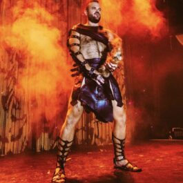 Boylesque male dancer for hire poses on stage in Brighton